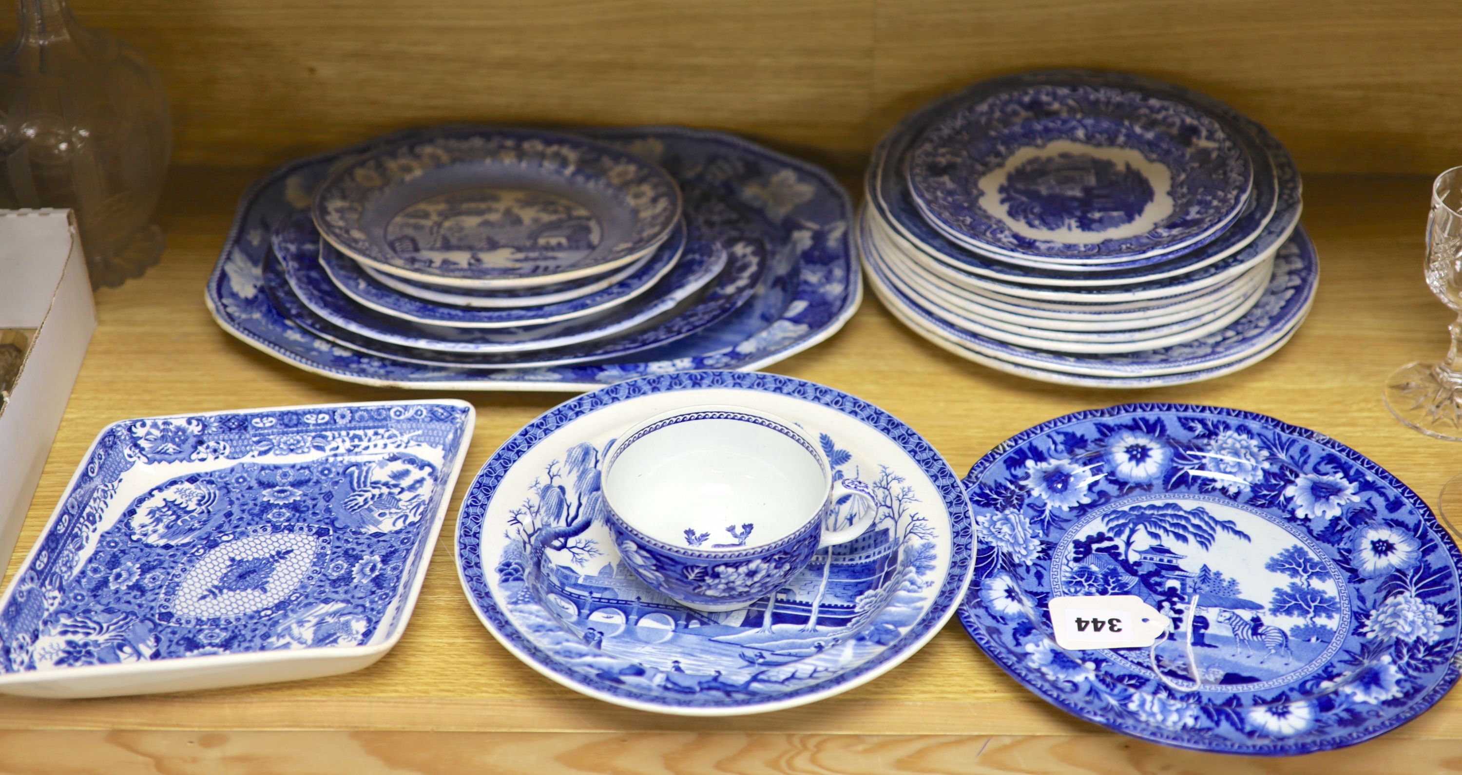 A quantity of 19th century blue and white pottery, including a Harewood House platter, 37cm, and a Spode Rome Tiber soup plate